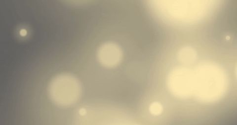 Abstract glowing light spots on soft grey background