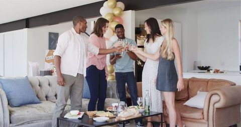 Diverse Group of Friends Celebrating at Housewarming Party