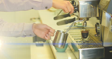Barista Making Espresso Mocha with Steam Wand in Cafe