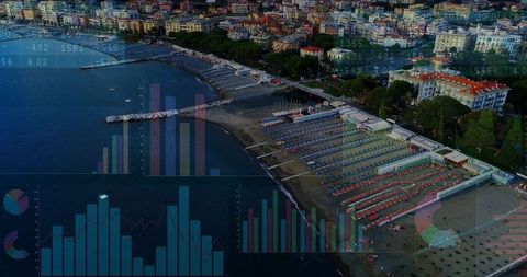 Aerial resort beach with organized sunbeds, piers and data overlay for tourism analytics
