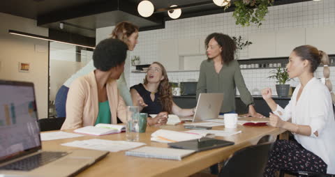 Diverse Team Collaborating in Modern Office Meeting