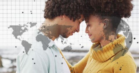 Romantic couple touching foreheads with world map overlay