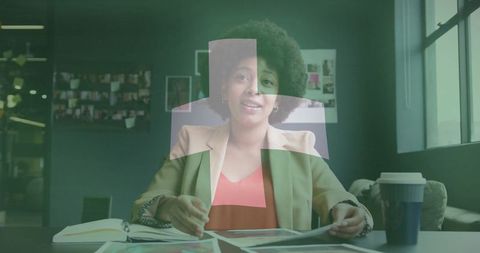 Creative professional reviewing layouts at modern office workspace