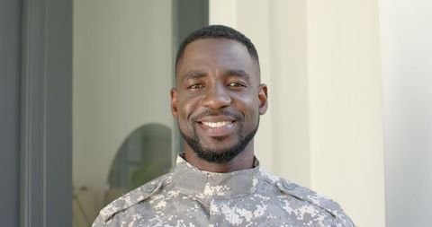 Confident African American Soldier Smiling Outdoors in Military Uniform