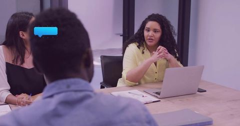 Confident Woman Leading Team Meeting in Modern Conference Room