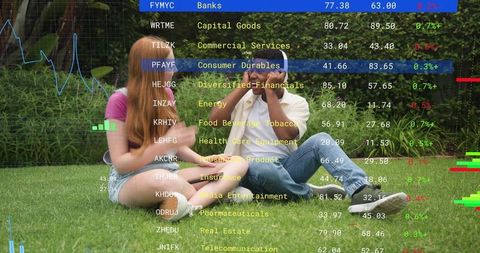 Friends viewing smartphone on lawn with stock market overlays and data visualization
