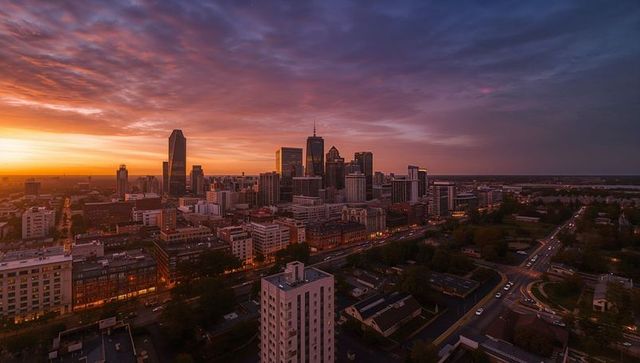 Sunset Urban Skyline Over Riverfront with Glass High-Rise and Dramatic Twilight Clouds