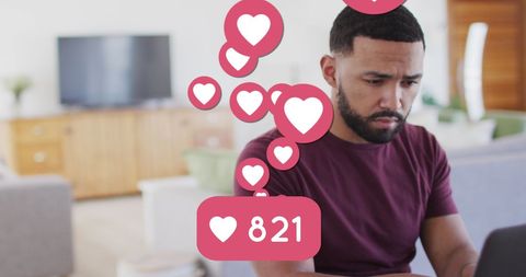 Man Managing Social Media Growth with Love Heart Notifications