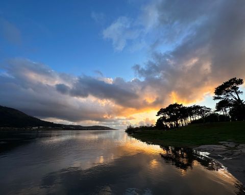 Serene beach sunset with vibrant cloud reflection