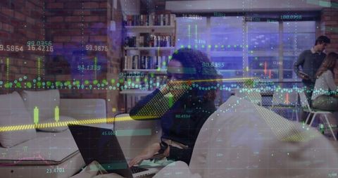 Financial Data Overlaid on Women Working with Laptop