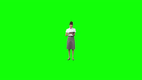Woman Reading Ebook on Digital Device with Green Screen Background