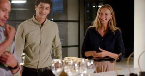Diverse Colleagues Enjoying Business Event Near Table with Glasses