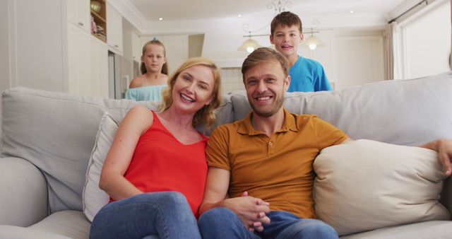 Happy Family Relaxing on Sofa in Modern Living Room - Download Free Stock Images Pikwizard.com