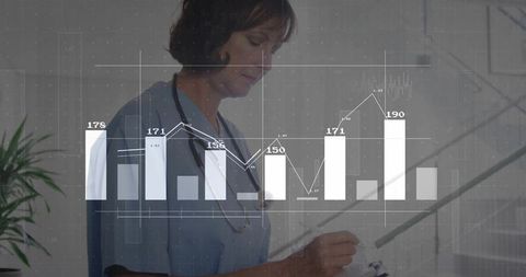 Clinician in medical environment analyzing diagnostic data