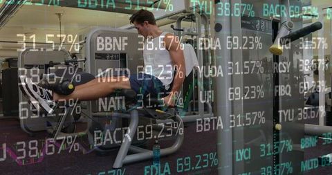 person working out on leg extension machine with financial overlays - Download Free Stock Images Pikwizard.com