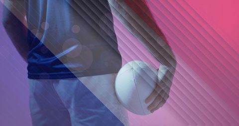 Caucasian Male Rugby Player Holding Ball with French Colors