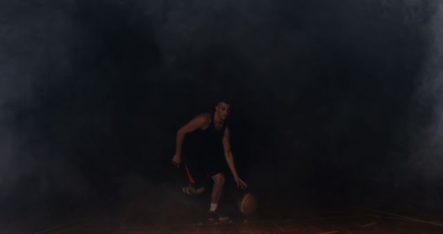 Basketball Player Dribbling in Dimly Lit Court with Smoke - Download Free Stock Images Pikwizard.com