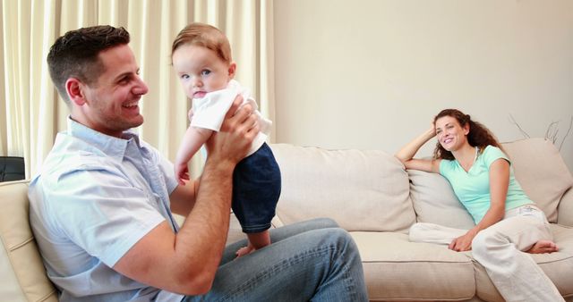 Happy Parents Spending Quality Time with Infant in Modern Living Room - Download Free Stock Images Pikwizard.com