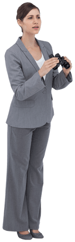 Curious young businesswoman in gray suit holding binoculars, symbolizing exploration and future vision, ideal for concepts of foresight and business strategy. Perfect for corporate presentations, project planning visuals, and leadership articles. Can be used in marketing for enhancing themes of exploration and finding new opportunities.