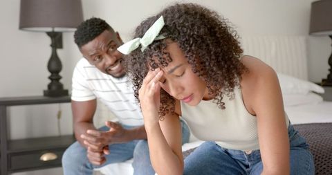 Stressed Couple Engaged in Emotional Discussion On Bed - Download Free Stock Images Pikwizard.com