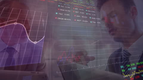 Business Professional Analyzing Data on Digital Tablet