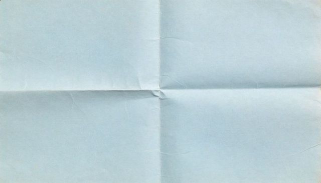 Pale blue folded paper with center crease, soft wrinkles and minimal texture