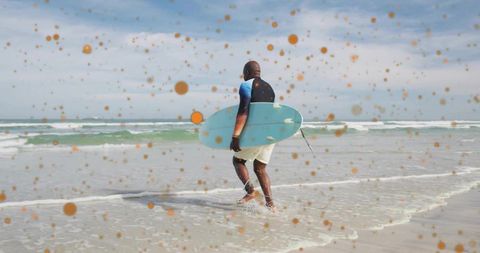 Senior Surfer Walking with Board into Ocean Delight
