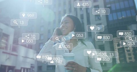 Smiling professional woman with smartphone surrounded by share icons