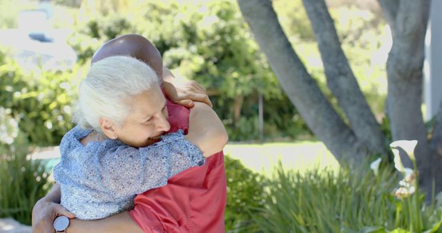 Senior Woman and Friend Embracing Outdoors in Park - Download Free Stock Images Pikwizard.com