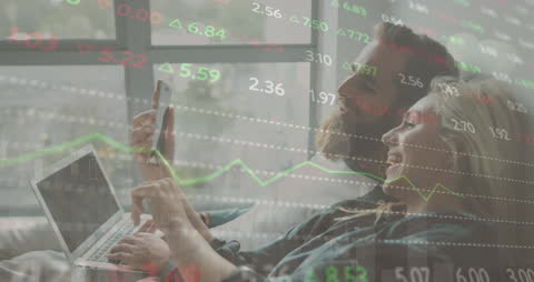 Happy Couple Discussing Stock Market Investments at Home