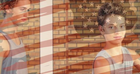 Teen basketball players practicing with american flag overlay