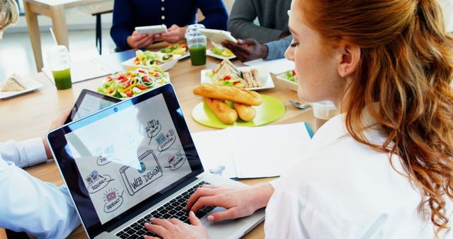 Young Professional Working During Team Lunch Meeting - Download Free Stock Images Pikwizard.com