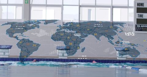 Competitive swimmer training in indoor pool with futuristic world map data overlay