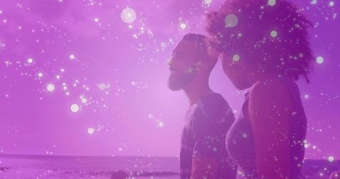 Couple Reflecting on Beach with Dreamy Purple Overlay