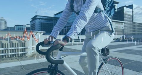 Businessman Riding Bike with Financial Data and Urban Background - Download Free Stock Images Pikwizard.com
