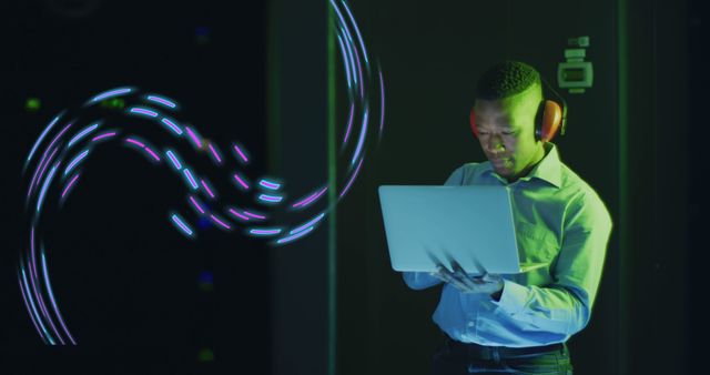 Image of data processing over african american it technician by computer servers. Global cloud computing, digital interface and data processing concept digitally generated image.