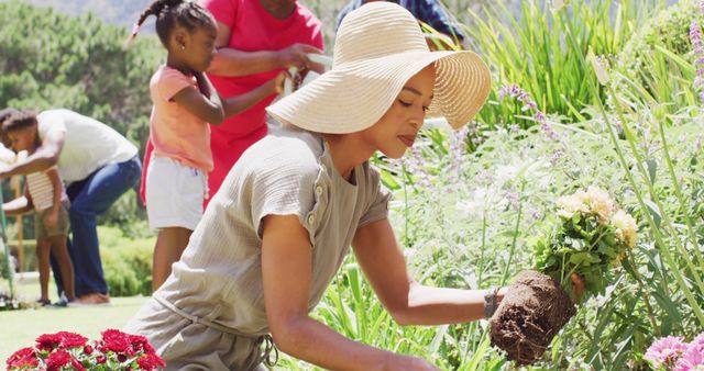 African American Family Gardening Outdoors on a Sunny Day - Download Free Stock Images Pikwizard.com