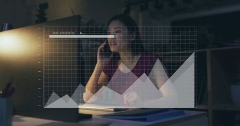 Businesswoman Analyzing Data at Night Desk