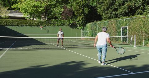 Senior Couple Enjoying Tennis on Sunny Day - Download Free Stock Images Pikwizard.com
