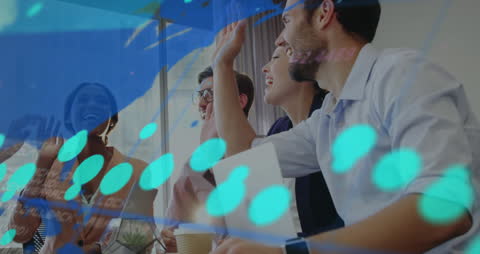 Multiracial Team High-Fiving in Modern Office with Digital Overlay