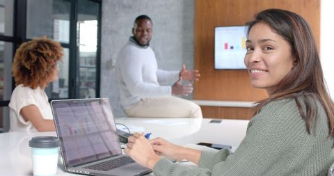Smiling Businesswoman Collaborating in Modern Office
