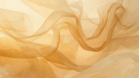 Ethereal flowing beige fabric layers drifting in soft light with textured sand backdrop
