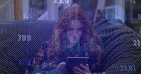 Modern Technology in Home Setting with Woman Analyzing Data on Tablet