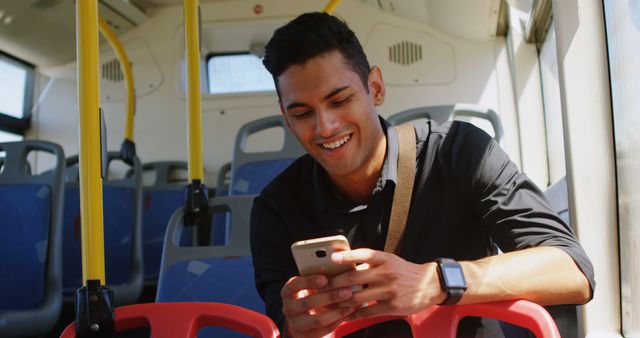 Young Man Enjoying Smartphone on Public Bus - Download Free Stock Images Pikwizard.com