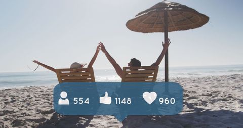 Couple Relaxing on Beach with Social Media Overlay