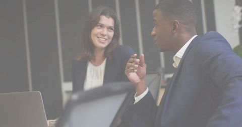 Business Colleagues Collaborating at Office Conference Table