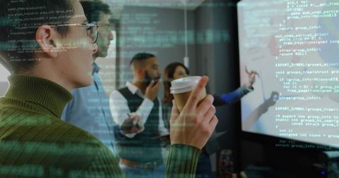 Team Analyzing Code with Digital Projection and Coffee Break