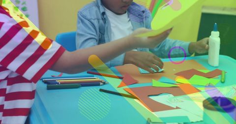 Creative Young Students Engaged in Art Project with Colorful Materials