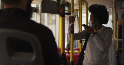 Woman with Face Mask Using Smartphone in Public Transport - Download Free Stock Images Pikwizard.com