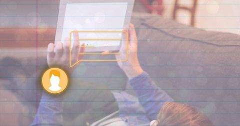 Casual home lounging with tablet and digital chat icon